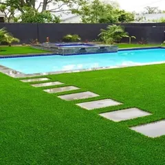 A perfect lawn right by the pool, with no mud or grass clippings getting in the water. My artificial turf is durable, drains quickly, and looks incredible year-round, making it the ideal choice for poolside landscaping and outdoor entertainment areas.