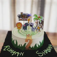 A fun jungle-themed chocolate cake I made for a set of twins turning two. I can customize cakes with any theme your child loves, complete with edible decorations and toppers to make their birthday extra special.