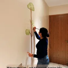 Midway through the process, the tree is starting to get its leaves. It's already turning into something dreamy and special for the tiniest art lover.