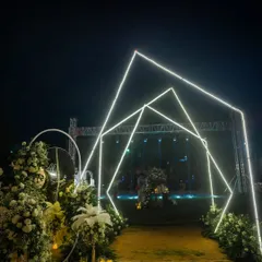 A pathway of geometric, illuminated arches guided guests toward the main stage. This entrance was designed to build anticipation and immerse everyone in the elegant theme of the night.