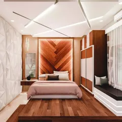 A bedroom should be your personal sanctuary. This design for a client in Mysore features a backlit herringbone wood accent wall, a custom 3D panel wall, and a modern false ceiling design to create a luxurious and calming atmosphere.