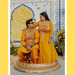 A sweet, candid moment between Abhinav and Paromita during their Haldi. Her playful look over her sunglasses captures the fun and relaxed vibe of the day.