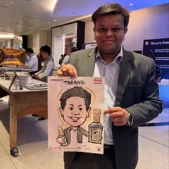An attendee at the Jio World Convention with his custom caricature. I incorporated elements related to the event's sponsors, making it a branded takeaway.