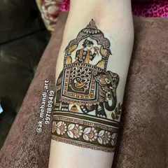 This majestic elephant, a symbol of royalty and good fortune, is a popular choice for bridal arm bands. I love adding details like the decorative saddle and peacock motif.