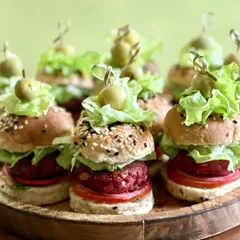 Golden buns, loaded patties, and layers of crunch. I offer a wide variety of patty options for my sliders, including sweet potato and beet, Mexican bean and avocado, veg galouti, and truffle mushroom. There's a flavor for every palate.