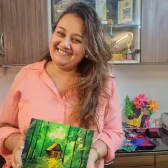 This student created a peaceful, dreamy forest scene with a cozy cabin. Her beautiful smile reflects the calm and soulful feeling that comes from getting lost in the world of painting.
