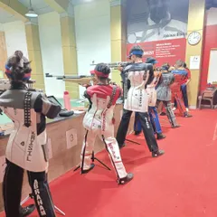 A line of our young shooters in full gear, practicing their stance and aim. We emphasize fundamentals and precision from the very beginning of an athlete's journey.