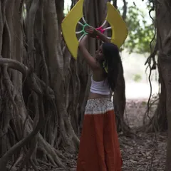 Another shot from my fan dance session among the banyan roots. The structure of the fans contrasts so beautifully with the organic shapes of nature.