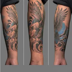 Three angles of the eagle sleeve tattoo, showcasing how the design flows with the arm. The combination of black, grey, and blue creates a striking and cohesive piece.