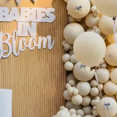 The combination of large and small balloons in a monochromatic scheme creates a visually stunning texture.