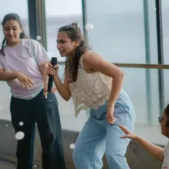 Here I am, leading a group through a fun routine at a wellness event. We focus on simple, feel-good movements that help break the monotony of the workday and boost team morale.