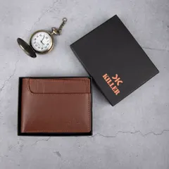 A creative flat-lay of a men's brown leather wallet, shown with its branded box and a vintage-style pocket watch to evoke a sense of classic style and quality.
