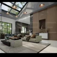 This angle shows how we create cohesive, open-plan living areas. The living room, dining space, and kitchen flow into one another under a vaulted ceiling with a skylight, making the entire area feel spacious and connected.
