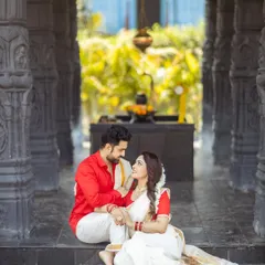 A beautiful moment between a couple during their pre-wedding shoot. The traditional setting and outfits create a truly magical atmosphere.