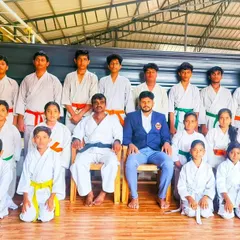 A group photo after a successful grading examination. Each new belt earned is a milestone in a student's journey of self-improvement.