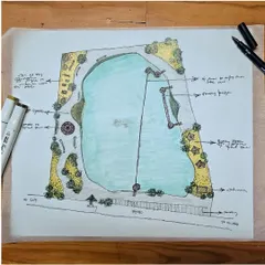 A detailed concept plan for a lakefront development project, rendered by hand. This sketch outlines key recreational features like a floating bridge, boating zones, a zip line, and dedicated walking paths, all integrated into a cohesive landscape design that balances nature and community activity.