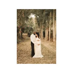 From bump to bond, this image captures the couple standing together on a path in the woods. It's a chronicle of love and anticipation, a memory of their life before three.