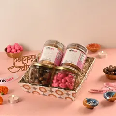 The "Utsav" hamper is a celebration of flavors, combining our Butter Almond and Oat & Raisin cookies with Pink Almond Dragees and Chocolate Coated Cashews.