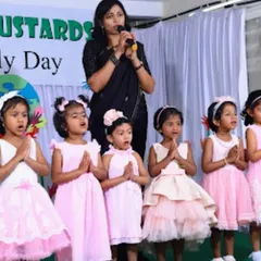 A group of girls performing a song for their families. Our Family Day is a wonderful opportunity for children to showcase their talents and build their confidence on stage.
