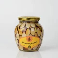 A jar of Acacia Honey with Nuts, shot on a clean white background. We ensure the label is perfectly legible and the product is the hero of the image.
