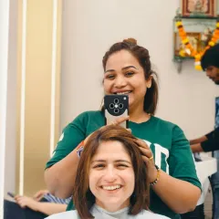Capturing the happy moment right from the salon chair. A fresh haircut and color always brings out the biggest smiles.