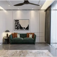 A minimalist take on the home office, this space features a striking emerald green sofa set against clean white walls. A bold piece of abstract art adds personality, creating a space that is both stylish and conducive to creative thinking.