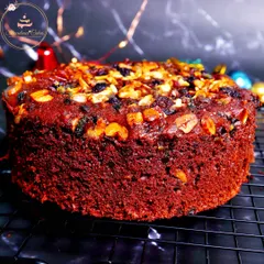 My classic Christmas plum cake is a festive favorite, made without any alcohol. It's incredibly moist and dense, packed with a generous amount of premium soaked fruits and nuts, offering a rich, traditional flavor in every bite.