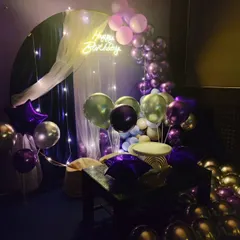 For this party, we went with an elegant purple, silver, and gold theme. The fairy lights, sheer curtain, and neon sign create a dreamy, magical atmosphere perfect for a stylish birthday celebration.