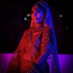 Here, I experimented with colored gels, using red and blue light to create a modern, dramatic bridal portrait. This technique adds a unique, cinematic feel to the image while still highlighting the bride's stunning features and jewellery.