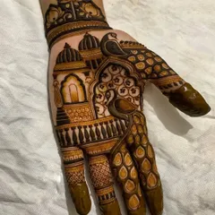 Here, I've blended two of my favorite styles. This hand design features elegant peacocks perched on a balcony, set against a backdrop of traditional Indian architectural domes.