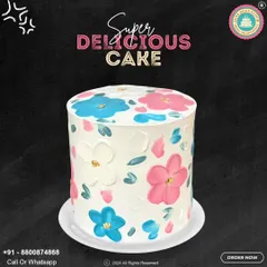 A beautiful and artistic floral cake. This design features hand-painted pink and blue flowers on a white buttercream canvas, creating a simple yet stunning look for any celebration.