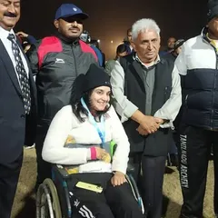 Shriya Joshi stands with officials and supporters after her win at the Para National Archery Tournament. The support system of coaches, family, and the archery community is a vital part of our athletes' success.