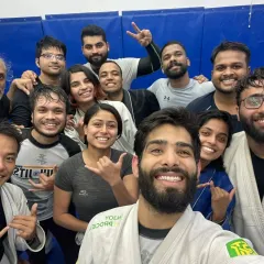 A diverse group of students, all smiles after a session. This is a place where everyone belongs.