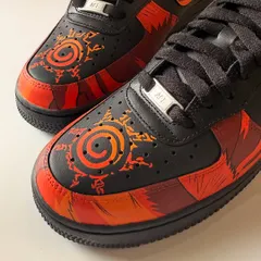 Another detail shot of the Kurama seal on the toe box. The gradient orange and red colours give it a glowing effect, making it stand out against the all-black sneaker.