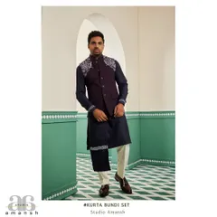 For an evening of elegance, we present this space blue bundi set. The deep tones of the bundi and kurta are highlighted by striking silver handwork on the shoulder and drape, a design made for engagements and cocktail parties.
