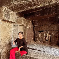 A moment of quiet contemplation inside a cave temple during Navratri. The nine nights of Navratri are a special time for devotion and dance, celebrating the different forms of the goddess Durga.