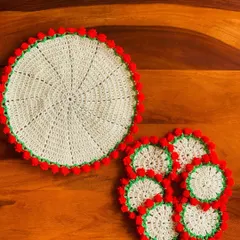 This placemat and coaster set features a classic cream color with a festive red tulip border. It's a versatile design that works for holidays or for adding a pop of color year-round.
