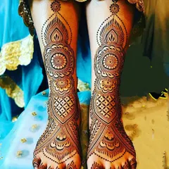 An elegant bridal foot design that mirrors the patterns of a traditional hand mehndi, with mandalas, geometric nets, and leafy vines.
