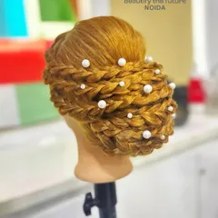 Another angle of this beautiful updo, showcasing the precision and creativity involved in its creation.