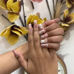 A different angle of our detailed bridal nail art. We use high quality materials to ensure your nail extensions are durable and look stunning throughout your celebrations.