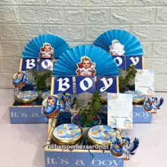 It's a boy! Our boy announcement hampers are a wonderful way to share your happy news. This one includes a pinewood basket, flavored foxnuts, chocolate cookies, a small planter, and a custom thank you card.
