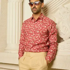 This long-sleeved linen shirt, with its understated red and beige floral print, is a perfect example of how I blend quiet charm with effortless elegance in my casual wear.