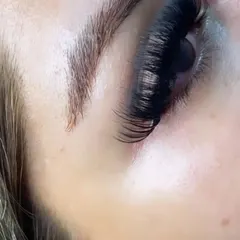 A macro shot of a volume lash extension set. This view emphasizes the texture and expert layering of the lash fans, which creates a full and multidimensional effect.