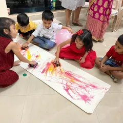 Process art is all about the experience, not the final picture. This car track painting activity is always a huge hit. It’s a fun, large-scale way for kids to explore color mixing and movement.