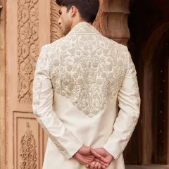 The artistry is visible from every angle. The back of this sherwani features a beautifully rendered panel of embroidery, ensuring a lasting impression.