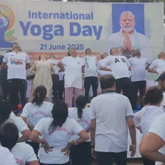 A moment of collective breathing and stretching during our International Yoga Day session. My tabla rhythms provide an auditory focus point, helping participants deepen their practice and connect more fully with their mind and body.