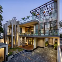 I believe landscaping should complement the architecture. For this modern villa in Faridabad, I used a mix of potted plants on multiple balcony levels and a curated ground-floor garden to soften the building's strong lines and integrate it with its natural surroundings.