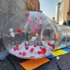 Here is a clear view of the Bubble House structure, set up and ready for a party. This one is filled with red and white heart-shaped balloons, but you can customize it for any theme.