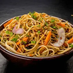 A glimpse of our popular Indo-Chinese menu. This is our signature Veg Hakka Noodles, stir-fried with crisp vegetables and our special sauce blend, perfect for wedding receptions and parties.