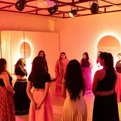 Leading a group of women in a circle of connection at The Immersion Room. These mindful movement sessions are designed to create a safe space for expression and stress relief, fostering a sense of community.